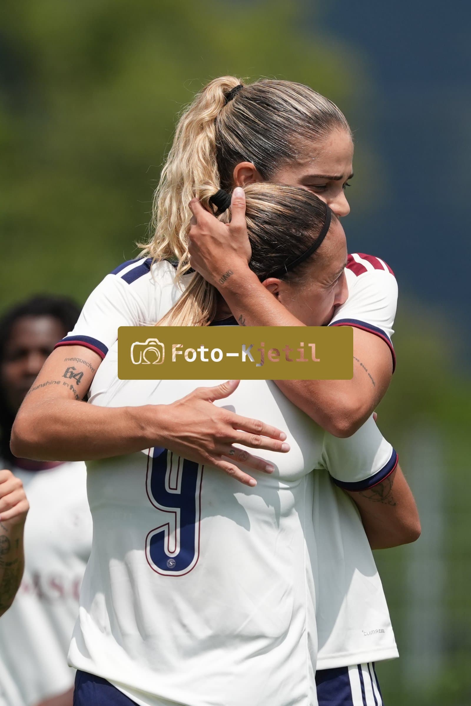 Crans-Montana, Switzerland - July 25: De al m da Eira Stefanie (64 SFCCF) celebrates with Gloria Marinelli (9 SFCCF) during the AXA Women's Super League match between Servette FC Chenois Feminin and FC Sion Feminin at Stade du Christ-Roi on July 25, 2026 in Crans-Montana, Switzerland.